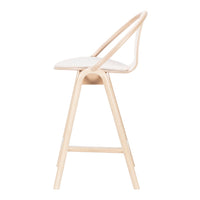 Light wood bar stool with a minimalist design and soft beige upholstery. Smooth lines and a stylish profile.