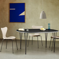 Modern black oval table with light beige chairs, set against a textured beige wall and a bold blue abstract art piece.