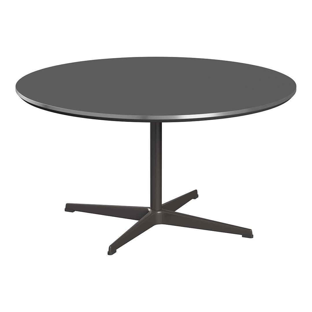 Round table with a sleek black surface and a sturdy gray base, perfect for modern decor.