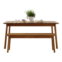 Natural wood dining table with a smooth finish and slatted pattern, accompanied by a matching bench.