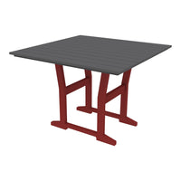 Square table with a dark gray top and red legs, showcasing a sleek, modern design.