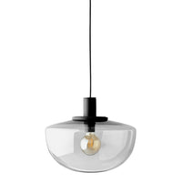 Clear glass pendant lamp with a sleek black top and a warm light bulb, featuring a modern, minimalist design.