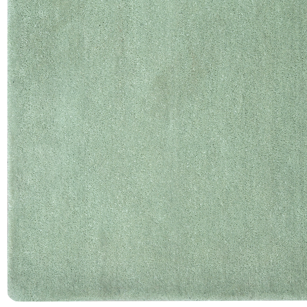 Soft mint green textured fabric with a smooth, solid finish, perfect for various home decor applications.