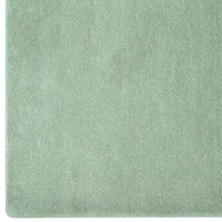 Soft mint green textured fabric with a smooth, solid finish, perfect for various home decor applications.