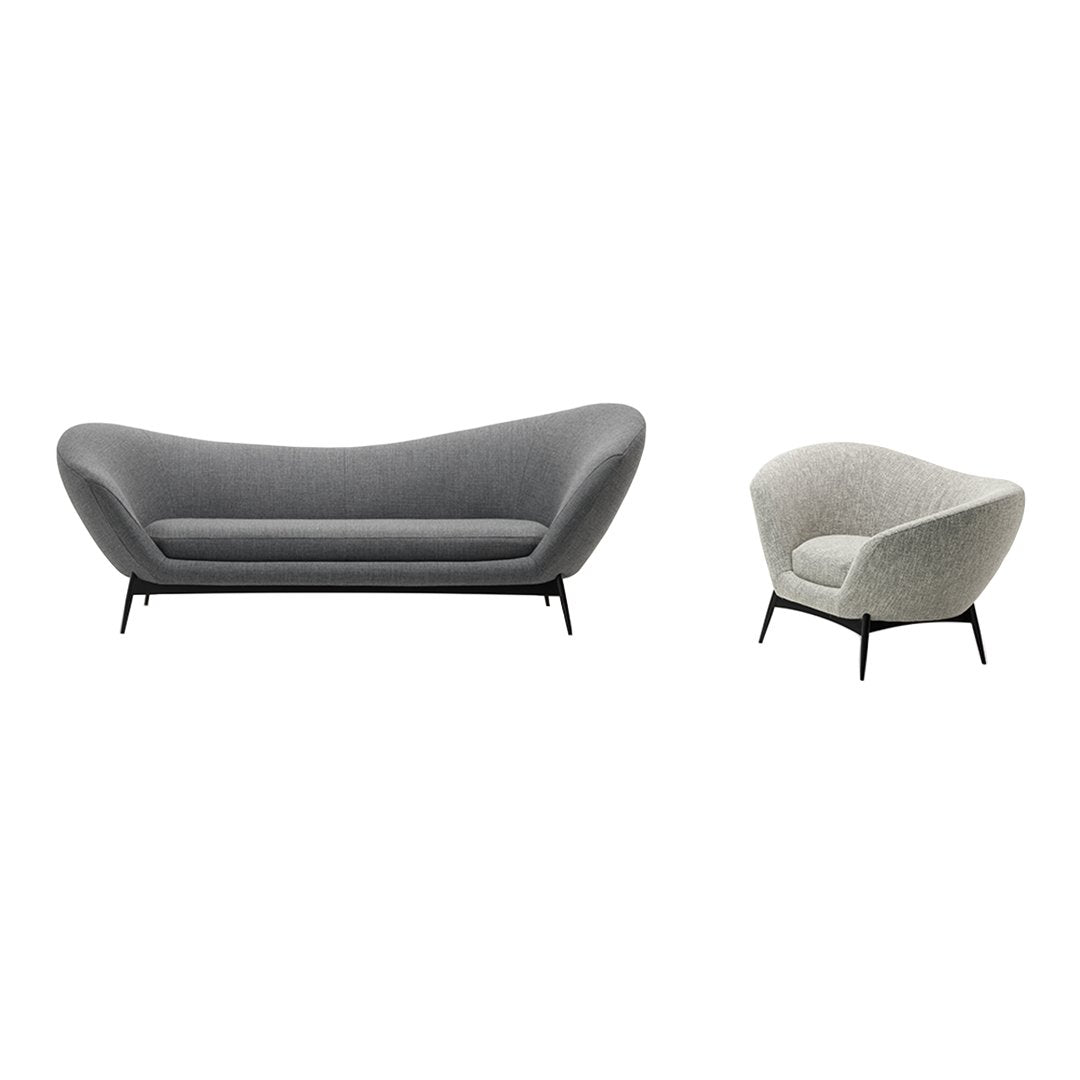 Gray fabric sofa and armchair set with smooth curves and minimalist black legs, perfect for modern decor.