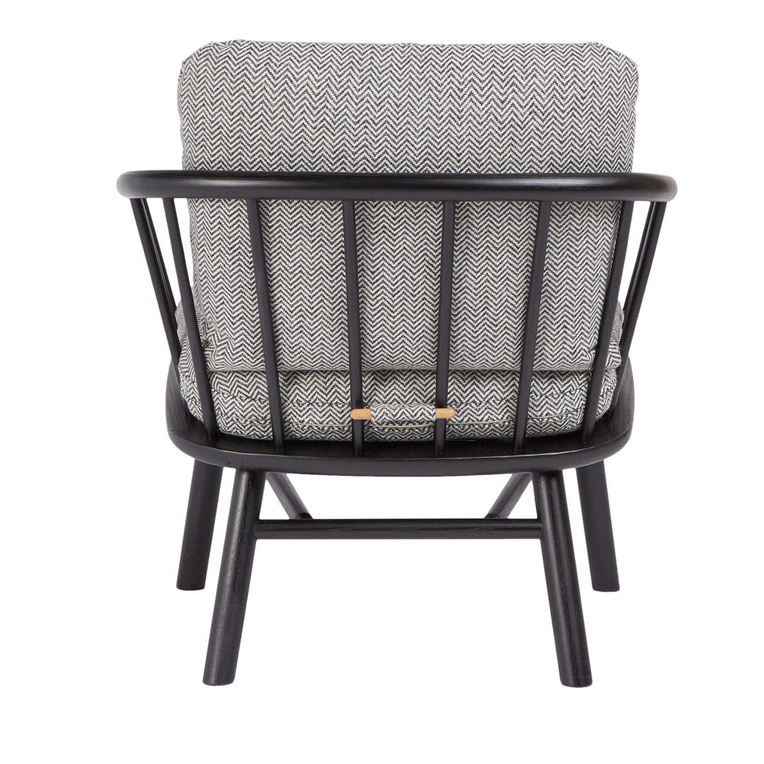 Gray patterned cushion in a black wooden frame, showcasing a modern and minimalist design.