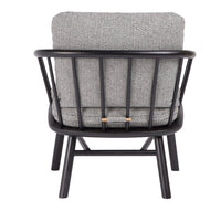Gray patterned cushion in a black wooden frame, showcasing a modern and minimalist design.