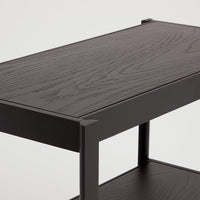 Dark wood grain tabletop with a sleek black frame, featuring minimalist design and smooth finishes.