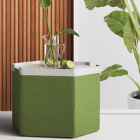 Green hexagonal side table with a white top, featuring a textured fabric finish and minimalist design.