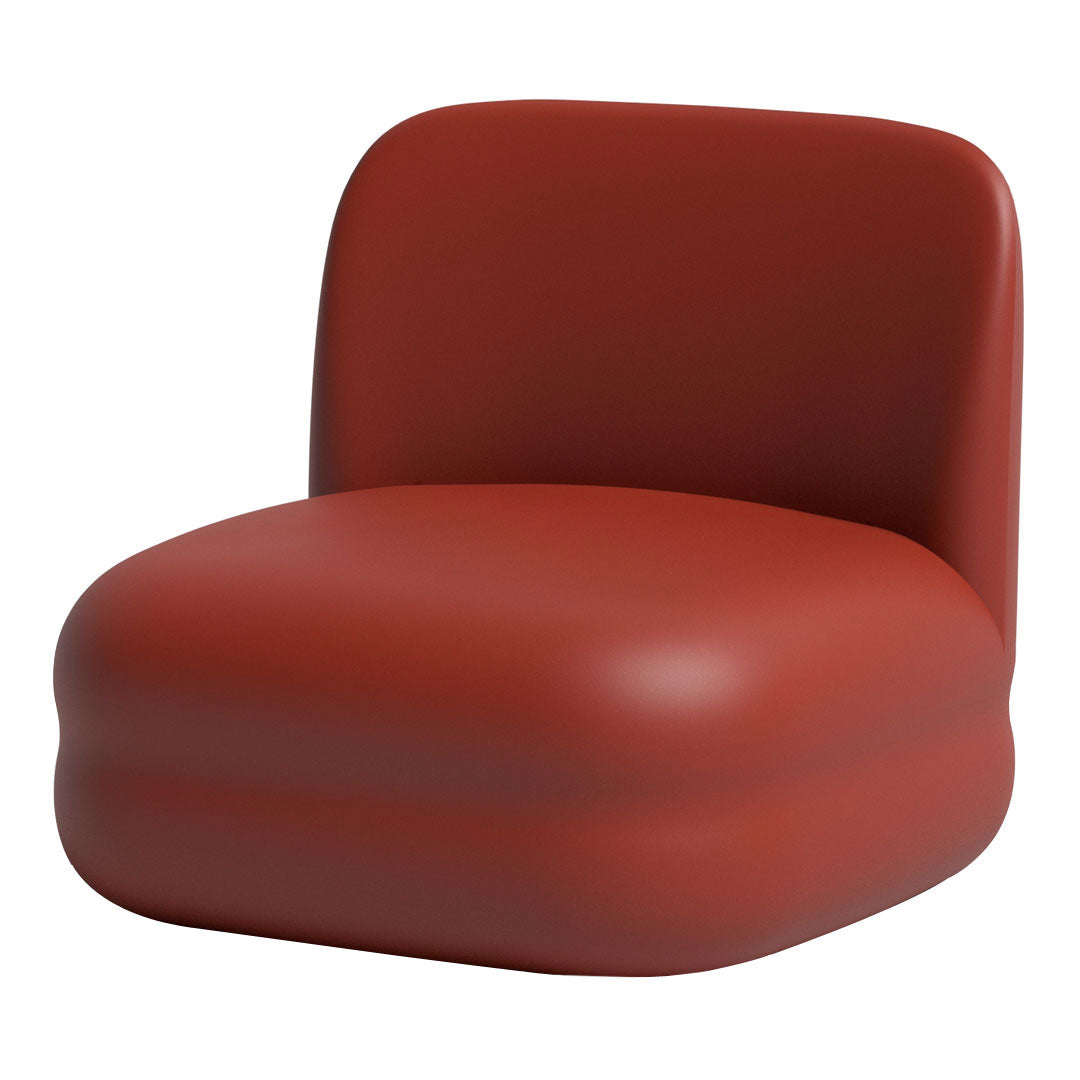 "Modern red padded chair with a smooth, rounded shape and minimalist design."