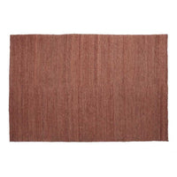 Textured rectangular rug in warm terracotta color with subtle vertical stripes, adding a cozy touch to any room.