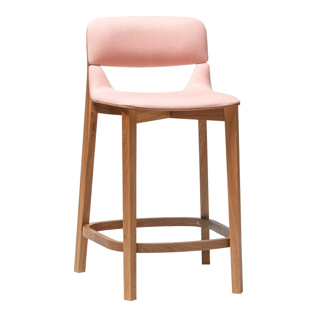 "Soft pink upholstered bar stool with a natural wood frame, featuring a minimalist design."