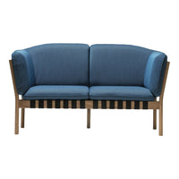 Two-tone blue sofa with sleek wood base and striped cushion design. Modern, stylish, and inviting.