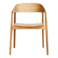 Natural wood chair with a light oak finish and a neutral beige seat, showcasing a minimalist design and smooth lines.