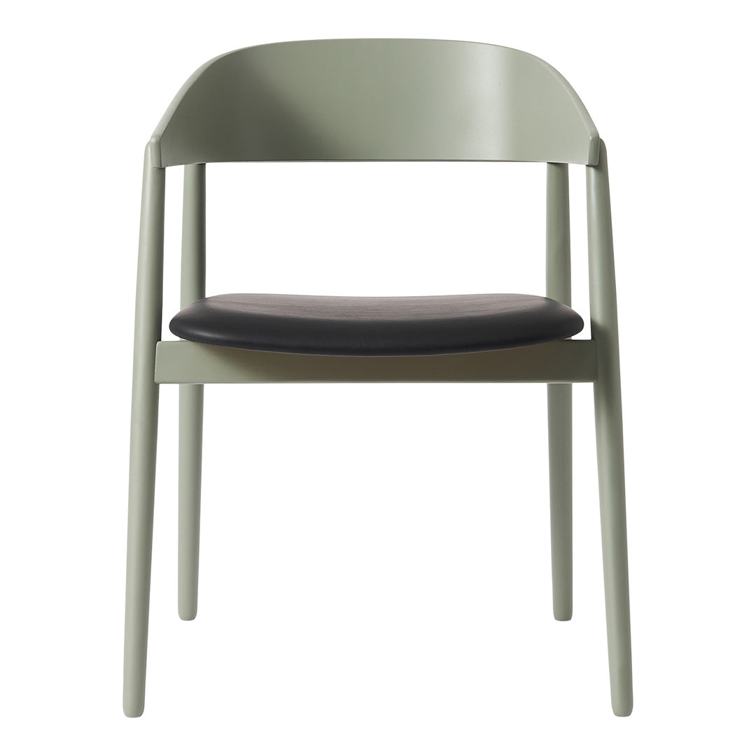Minimalist chair in soft green frame with a sleek black seat, perfect for modern decor.