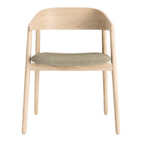 Light wood chair with a natural finish and a soft, muted green upholstered seat. Simple and modern design elements.