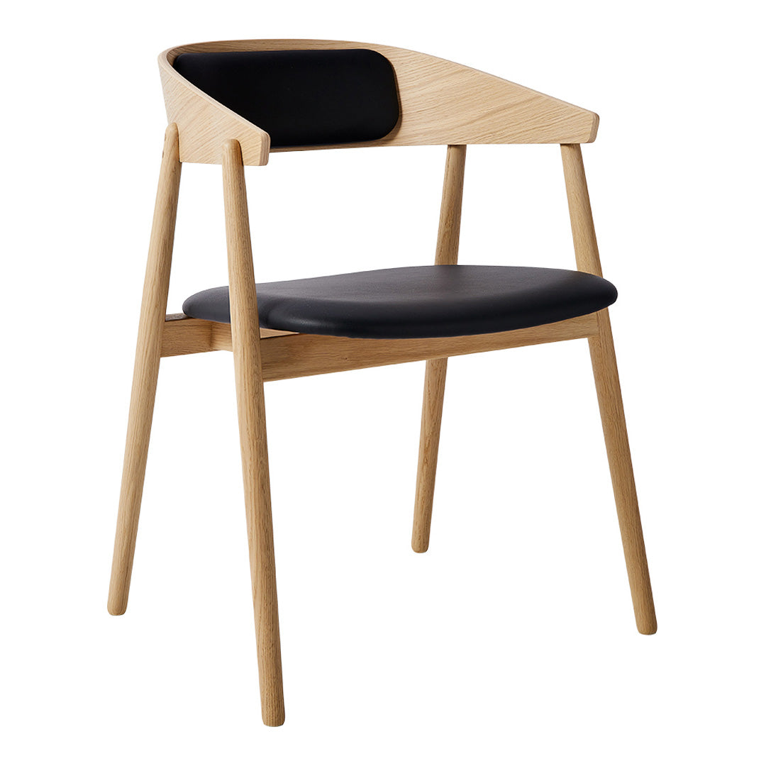 Black and light wood chair with sleek lines and minimalist design, featuring a black cushion and backrest.