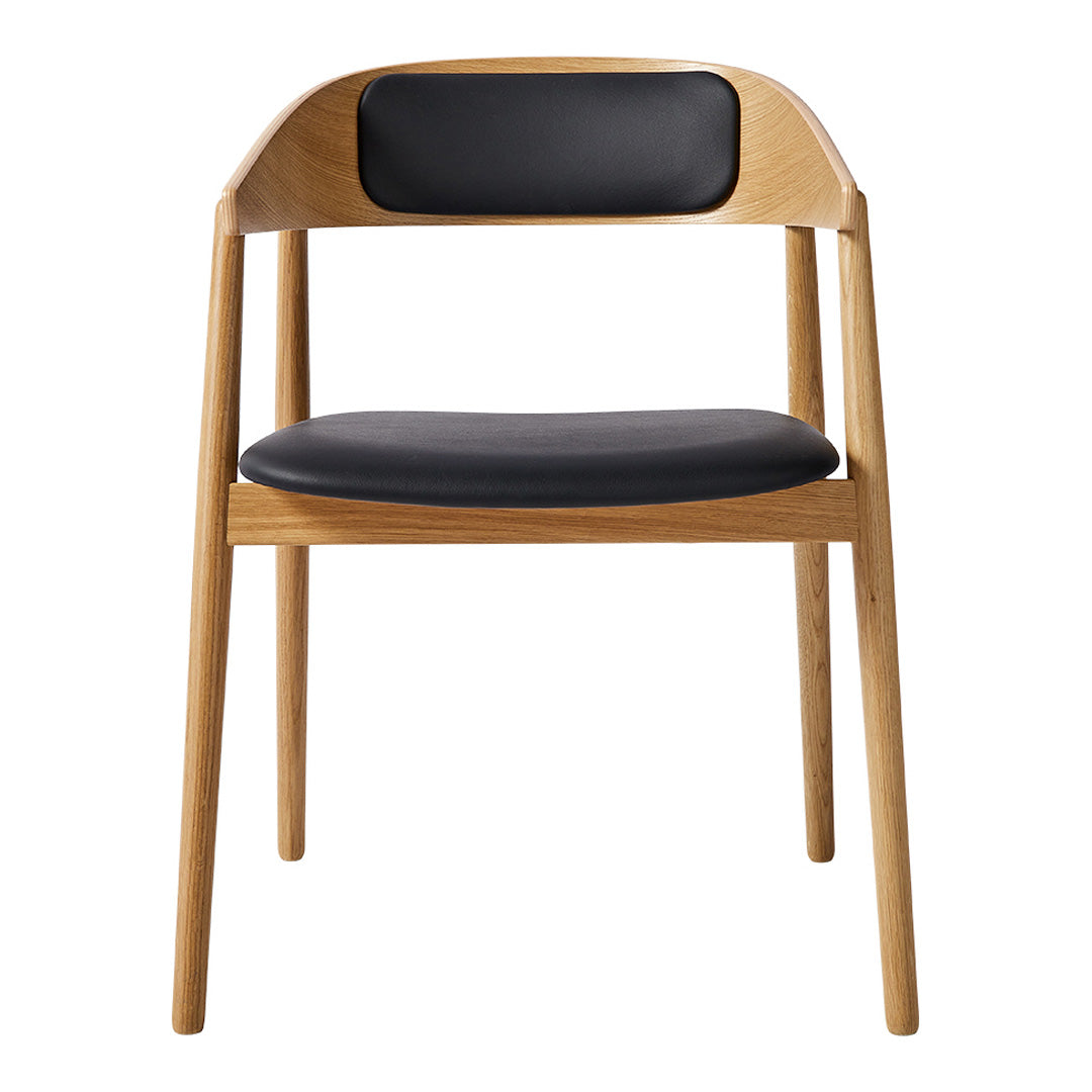 Natural wood chair with a light oak finish and a sleek black leather seat and back for a modern touch.