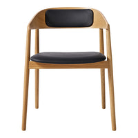 Natural wood chair with a light oak finish and a sleek black leather seat and back for a modern touch.