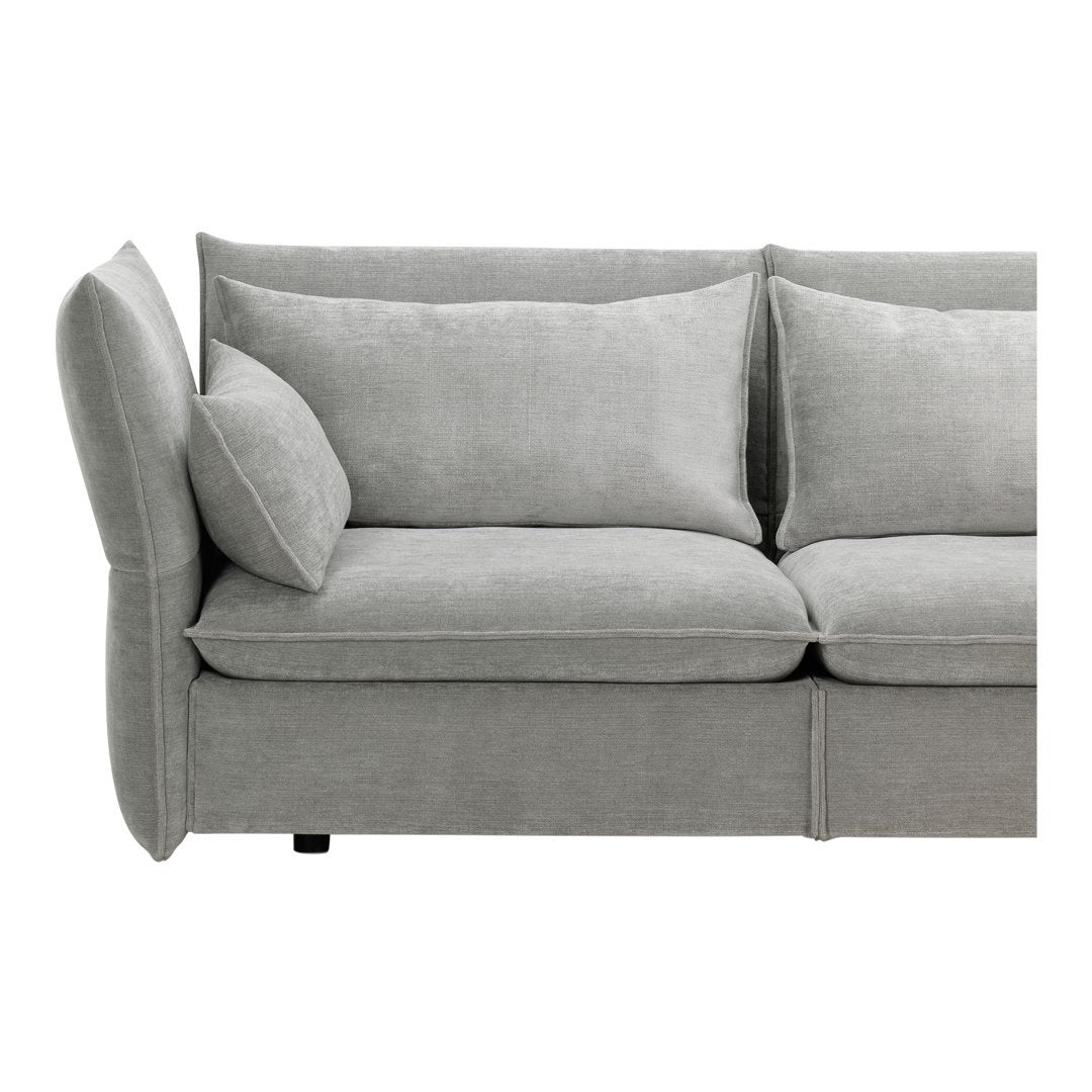 Soft gray sofa with plush cushions and a smooth, modern texture, featuring clean lines and minimalistic design.