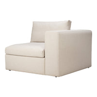Beige modular armchair with a solid, minimalist design and soft, textured fabric upholstery.