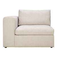 Beige sectional sofa with solid fabric and smooth texture, perfect for modern living spaces.
