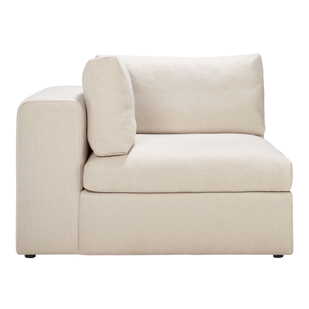 Beige upholstered corner sofa with a minimalist design, featuring a smooth fabric texture and simple, muted coloration.