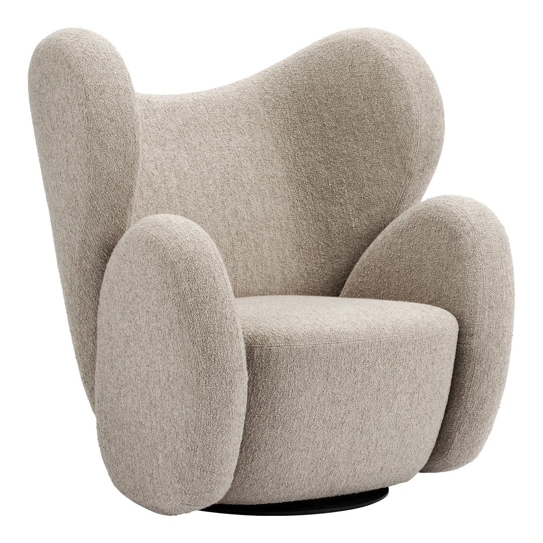 Beige ergonomic armchair with soft, rounded contours and a textured fabric pattern. Ideal for modern interiors.