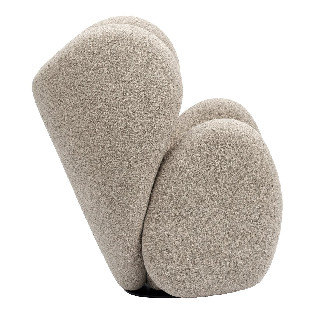 Beige upholstered chair with rounded, organic shapes and a soft, textured fabric. Ideal for modern interiors.