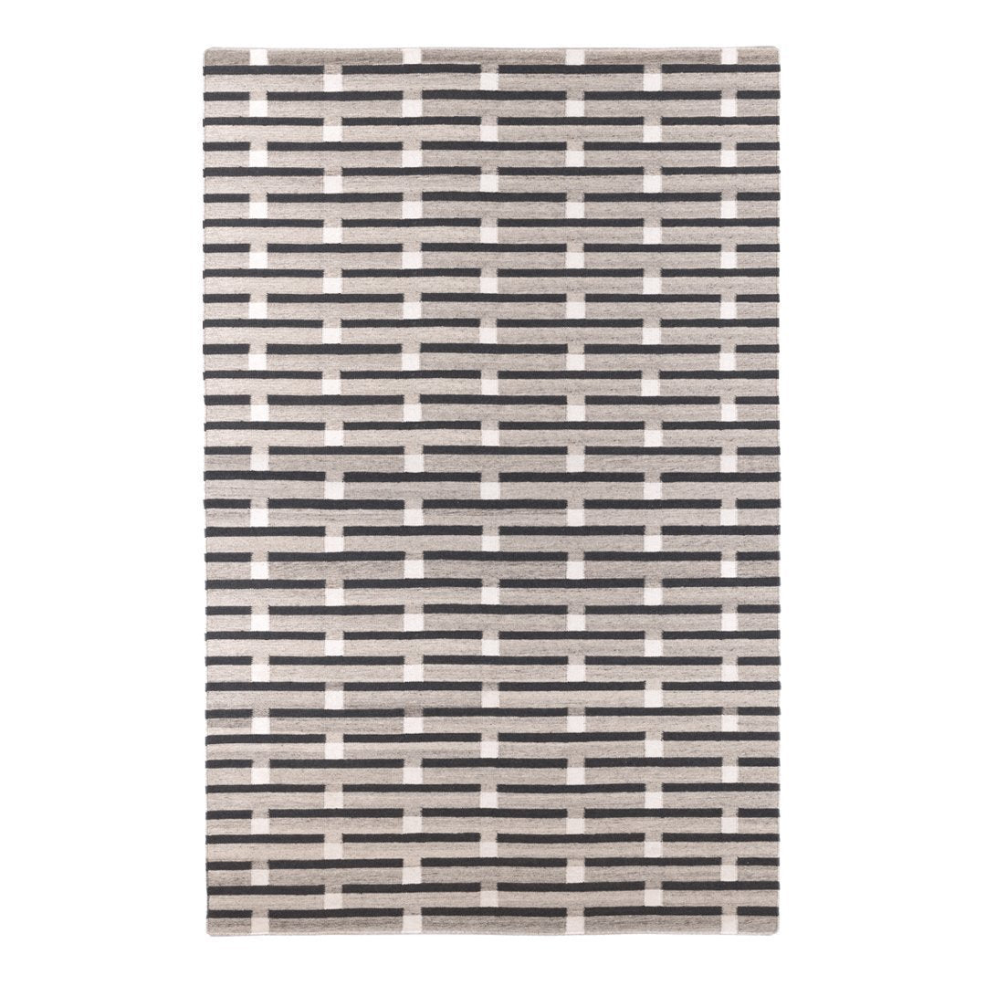 Black and white patterned area rug featuring a modern grid design. Perfect for stylish home decor.