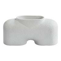 White textured ceramic vase with a unique abstract shape and smooth finish, perfect for modern decor.