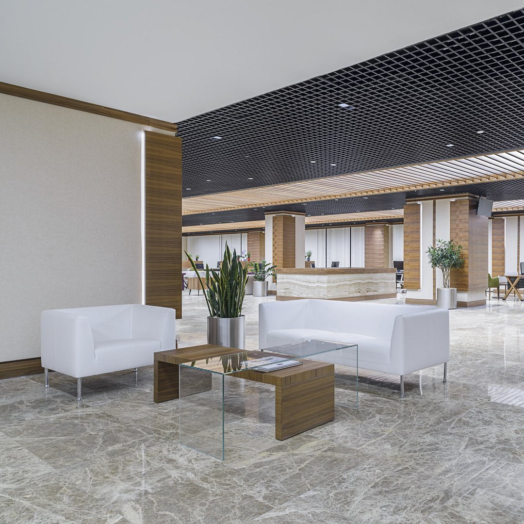Modern lounge area with white sofas, wooden accents, and marble flooring, featuring sleek lines and neutral tones.