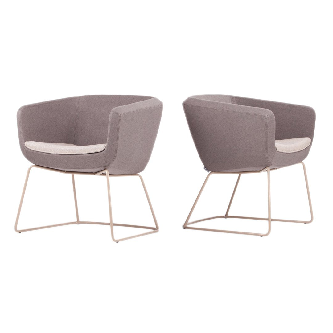 Stylish gray armchairs with soft beige cushions and sleek gold metal legs, offering modern elegance.