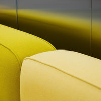 "Vibrant yellow and soft cream cushions, showcasing a modern design with distinct color contrast."