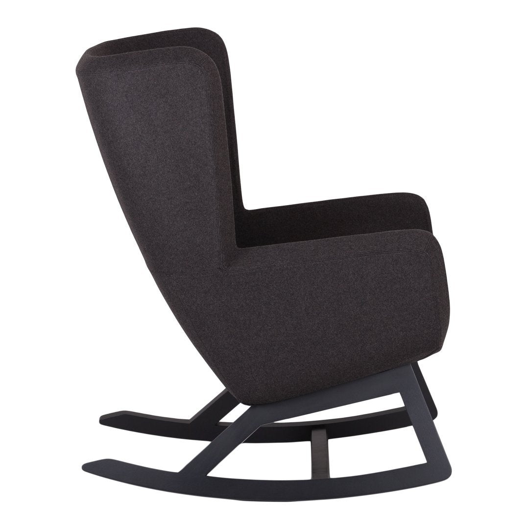 Sleek black rocking chair with a smooth, solid wood base and modern fabric upholstery, adding a minimalist touch.