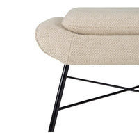 Beige textured upholstery with a curved edge and sleek black metal legs. Modern design for stylish interiors.