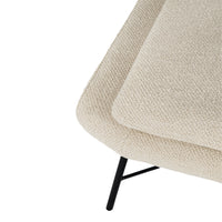 Beige textured fabric sofa with a smooth top and black metal legs, showcasing a modern minimalist design.