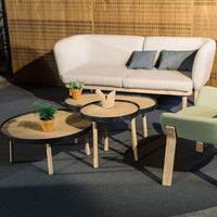 Modern furniture set featuring soft gray and green tones, with natural wood and round table designs. Ideal for stylish interiors.