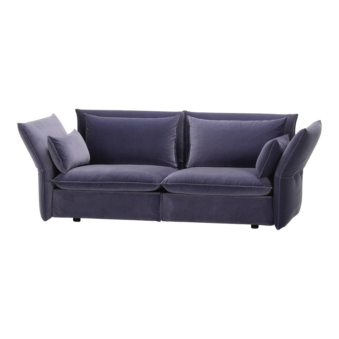 Stylish two-tone navy blue sofa with a textured fabric and plush cushions, featuring modern, playful lines.