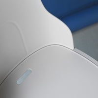 Sleek gray surface with a subtle light blue accent, set against a soft blue background. Modern and minimalistic design.