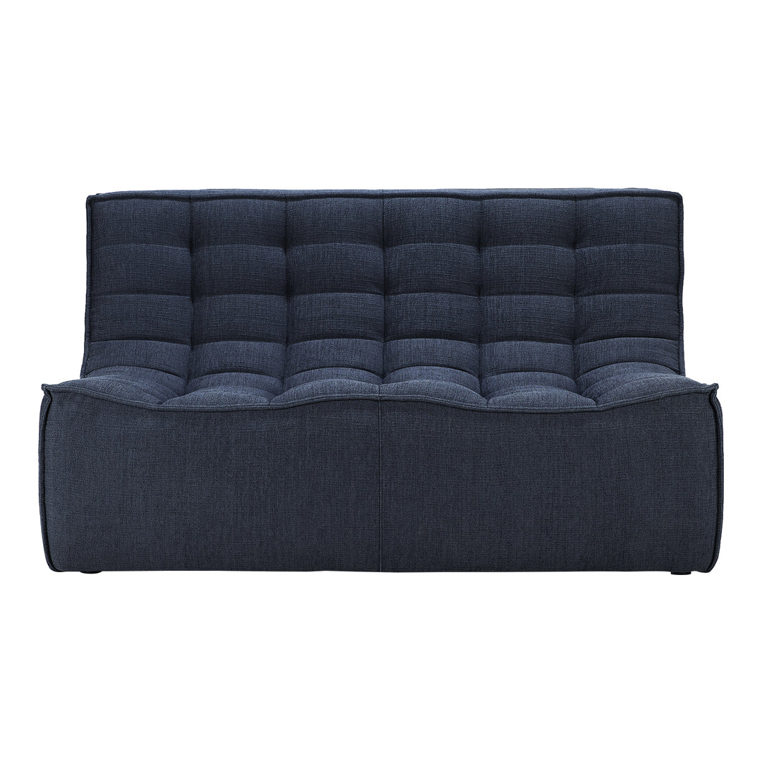 Dark blue tufted sofa with a modern, sleek design and textured fabric. Elegant and stylish for any space.