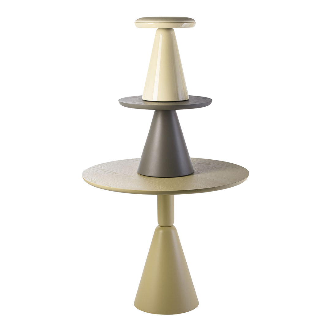 Stacked cone-shaped tables in soft beige, cream, and dark gray tones, featuring smooth, matte finishes.