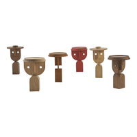 Colorful wooden stools featuring earthy tones and playful patterns, including red and natural wood finishes.