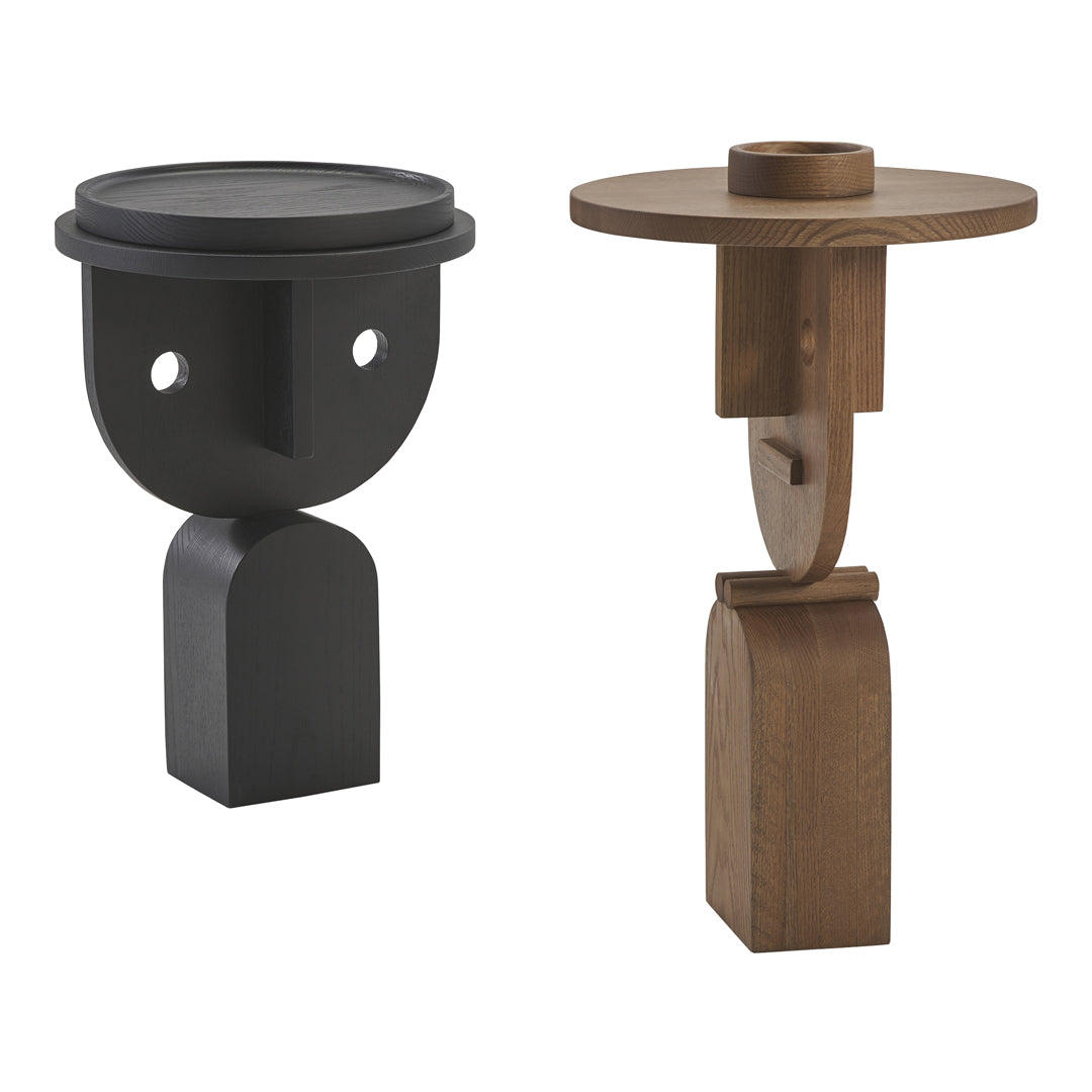Black and brown decorative side tables with unique geometric shapes and minimalistic designs.