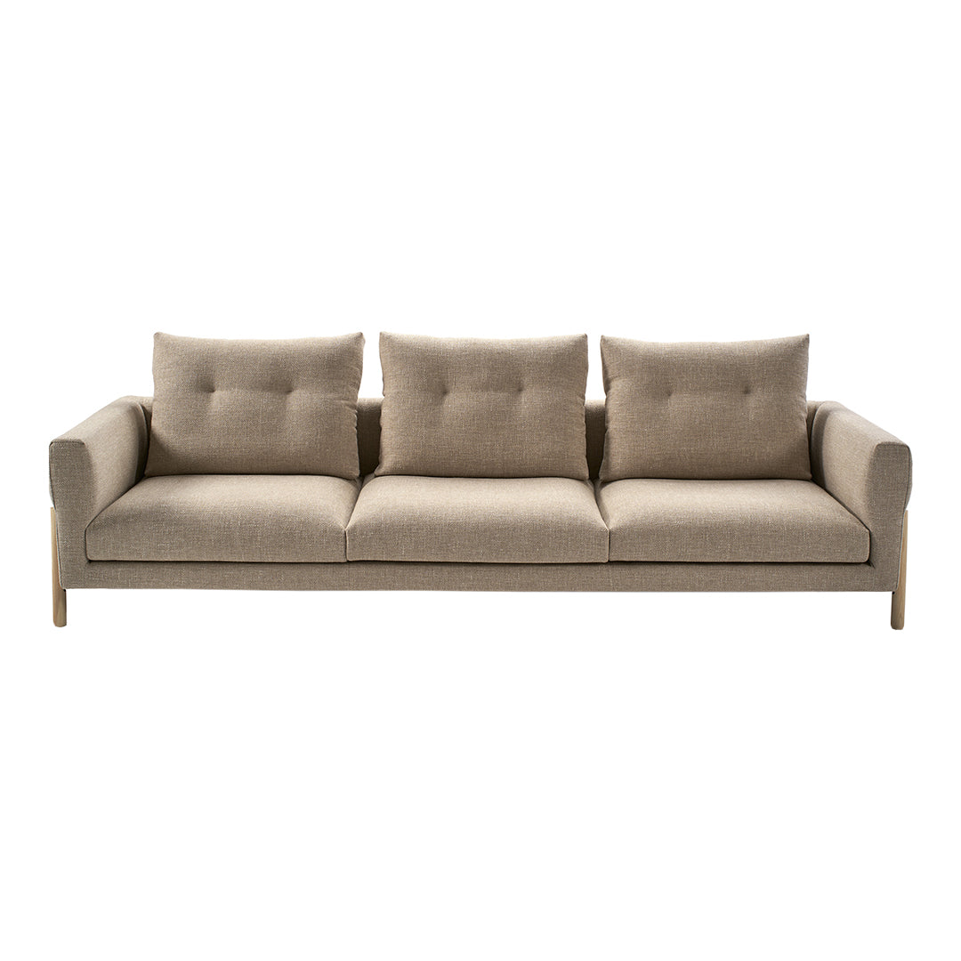Modern beige sofa with a smooth texture and three plush cushions, perfect for contemporary living spaces.