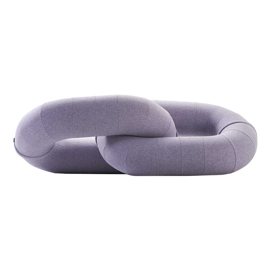 Purple interlinked cushion with a smooth, rounded design, featuring a soft fabric texture and subtle color variations.
