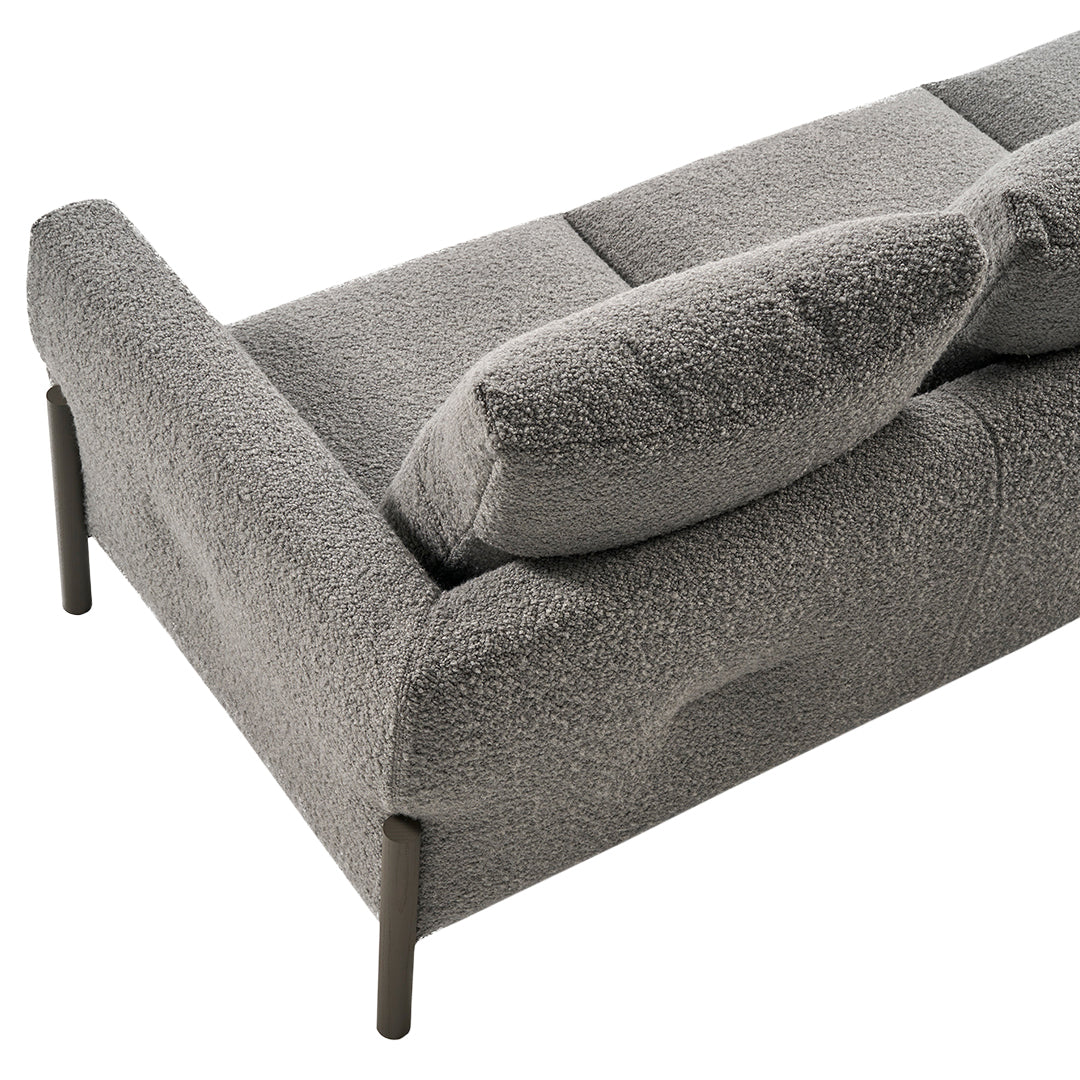 Soft grey textured sofa with plush cushions and sleek metal legs, perfect for modern interior styles.