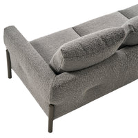 Soft grey textured sofa with plush cushions and sleek metal legs, perfect for modern interior styles.