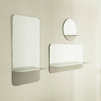 Modern wall mirrors in sleek rectangular and round designs, featuring a minimalist clear and mirrored finish.