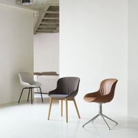 "Three stylish chairs in gray, brown, and tan hues with smooth finishes, set against a minimalist white background."